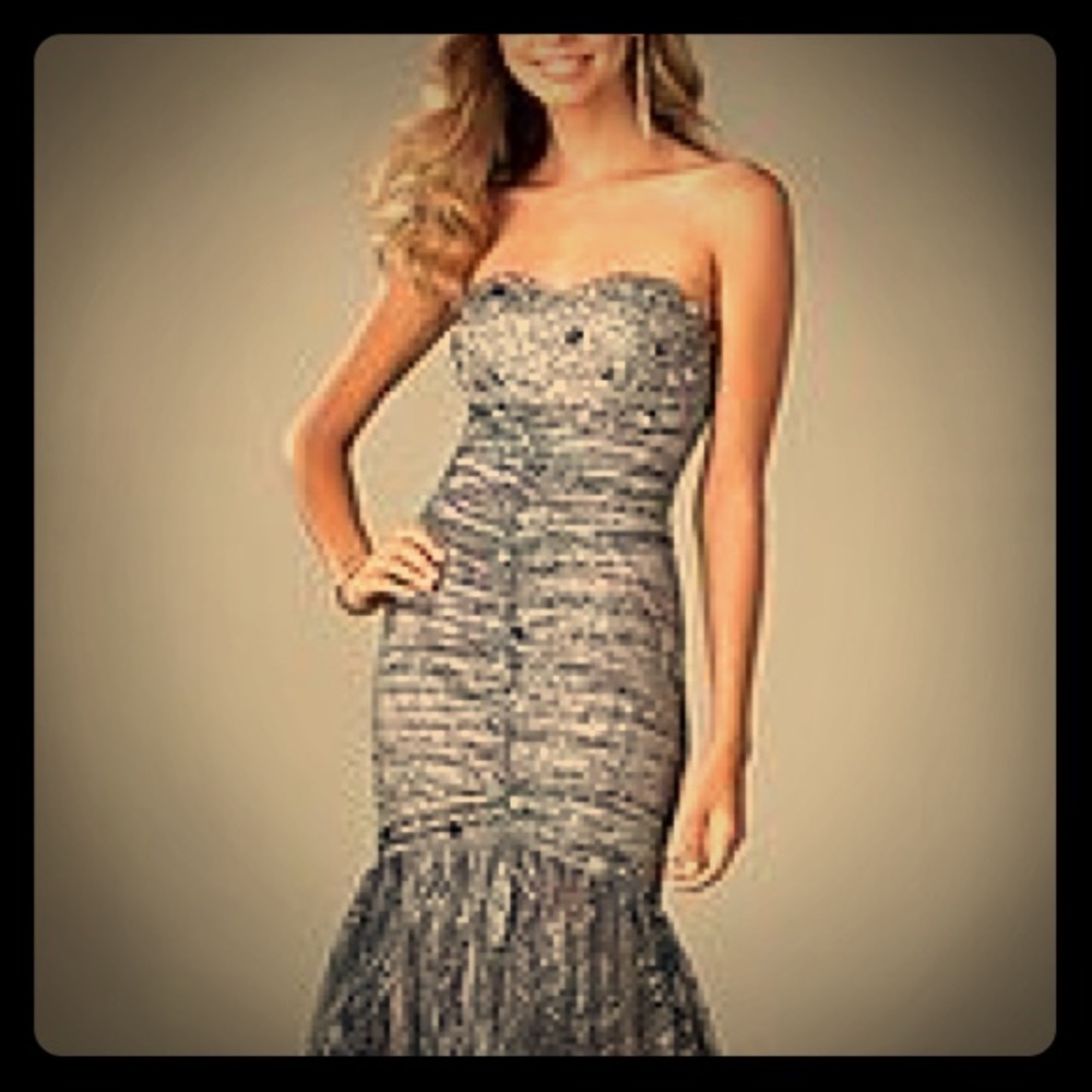 Brand NEW Beautiful strapless embellished gown.